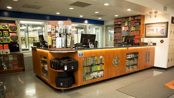 Check In Counter at the NRA Range Full of Accessories and Ammunition